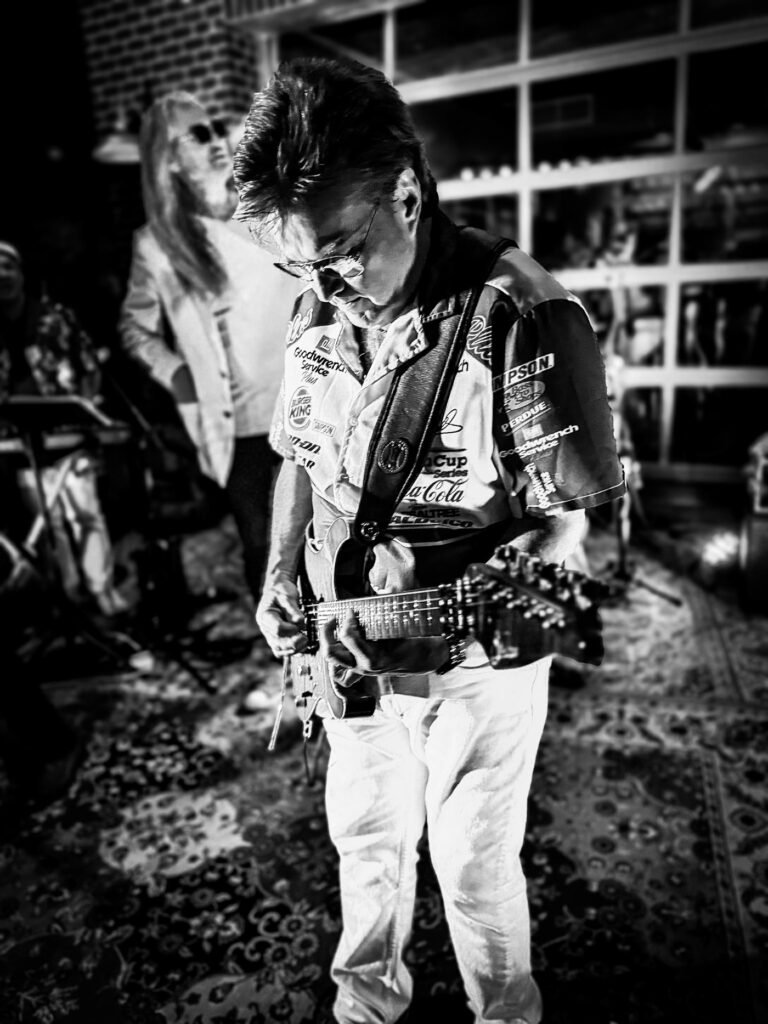 black and white photo of a guitarist playing rock music at a concert, high contrast, bride looking at her flowers while standing by the river gorge, waterfall - Bride resting her face on her groom's shoulders while dancing, smiling gracefully, Jacksonville wedding photographer, St. Johns River wedding, Florida beach wedding, Riverside wedding venue, San Marco wedding photos, Jacksonville Beach ceremonies, Ponte Vedra wedding, Treasury on the Plaza, River House St. Augustine, Jacksonville Beaches wedding, The White Room wedding, TPC Sawgrass wedding, Garden Club of Jacksonville, romantic sunset photos, Florida golden hour, Atlantic Beach wedding, Neptune Beach celebration, Jacksonville Arboretum photos, Downtown Jacksonville portraits, River City wedding, Ribault Club wedding, Epping Forest Yacht Club, Windsor Parke Golf Club, The Ritz-Carlton Amelia Island, Oceanfront ceremony, Spanish moss backdrop, Southern charm wedding, Jacksonville historical venues, Florida live oak trees, waterfront ceremonies, Cummer Museum gardens, The Club Continental, Jacksonville Golf & Country Club, maritime details, Jacksonville skyline photos, First Coast wedding, Northeast Florida wedding, coastal elegance, tropical florals, palm tree backdrop, destination wedding Jacksonville, intimate beach ceremony, luxury venue photography, Villa Blanca wedding, Jacksonville candid moments, wedding photojournalism, bridal party beach photos, Jacksonville engagement session, River & Post rooftop, black and white moments, emotional first look, MOSH rooftop wedding, Unity Plaza events, Friday Musicale venue, Jacksonville University, plantation wedding photos, natural light portraits, sunset beach portraits, romantic garden ceremony, The Glass Factory wedding, Sweet Pete's Candy wedding, authentic moments, Jacksonville architecture, historic Springfield photos, Riverside romance, Avondale wedding, vintage Jacksonville, metropolitan photos, cultural venues, Marineland wedding, The Manor at 12 Oaks, The Mansion at Glen Cove, Jacksonville Botanical Gardens, Jacksonville Zoo wedding, military wedding Jacksonville, NAS JAX celebration, timeless portraits, emotional storytelling, creative compositions, artistic wedding photos, film photography style, traditional southern wedding, modern Jacksonville wedding, urban wedding photos, classic bride portraits, documentary approach, bride and groom portraits, getting ready moments, wedding day details, wedding party photos, ceremony coverage, reception moments, dance floor candids, wedding rings macro, bridal accessories, venue details, wedding decor shots, architectural elements, dramatic lighting, romantic poses, authentic emotions, family formal photos, morning preparation, evening celebration, golden light portraits, destination details, venue exterior shots, Houston senior photographer, downtown Houston portraits, urban senior photos, Hermann Park senior session, Rice University campus, Buffalo Bayou portraits, Discovery Green photos, Houston murals backdrop, Waterwall senior pictures, McGovern Centennial Gardens, Heights senior session, Houston graffiti wall, Market Square Park photos, Eleanor Tinsley Park, Heights Boulevard portraits, Memorial Park senior photos, Japanese Garden session, Museum District portraits, Gerald D. Hines Water Wall, Montrose senior session, Sabine Street Bridge, Houston skyline backdrop, Sam Houston Park, urban rooftop photos, industrial Houston backdrop, vintage Heights buildings, Houston Theater District, Sugar Land Town Square, The Woodlands senior photos, Galveston Beach portraits, Kemah Boardwalk photos, Spring Creek senior session, natural light portraits, golden hour Houston, Houston street art, city chic portraits, modern senior photos, Texas wildflowers, bluebonnet season photos, graduation portraits, cap and gown photos, letter jacket photos, sports senior pictures, dance senior portraits, musical instrument photos, art student portraits, theatre senior photos, Houston street style, urban fashion photos, downtown tunnels, Houston architecture, contemporary portraits, editorial style senior, dramatic lighting, Houston landmarks, college campus photos, high school stadium shots, school spirit photos, candid moments, authentic portraits, Houston lifestyle photos, senior year memories, creative compositions, Houston color walls, artistic portraits, professional headshots, college application photos, yearbook portraits, seasonal senior photos, Houston summer shots, spring portraits, fall senior sessions, winter urban photos, Texas weather, Houston greenery, bayou backgrounds, park settings, urban landscapes, city reflections, metro rail backdrop, Houston Heights homes, vintage storefronts, boutique district photos, outdoor adventures, indoor studio shots, natural expressions, genuine smiles, environmental portraits, Houston culture, local landmarks, neighborhood shots, senior style, fashion forward, trendy locations, modern backdrops, classic settings, Houston diversity, cultural portraits, achievement photos, hobby photographs, sports action shots, extracurricular activities, senior accomplishments, Houston nightlife, twilight portraits, sunset sessions, urban sunset, cityscape backgrounds, local texture, Houston personality, Texas pride photos, hometown stories, senior milestones