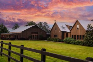 Pine Knolls Event Center's Outdoor Chapel in Appling Georgia, beautiful sunset falls over the catering banquet hall for wedding receptions
