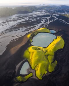 Spectacular view of a mountain terrain with melted show/polar caps and lush greenery shot with a DJI Mavic Pro 4 Aerial Footage