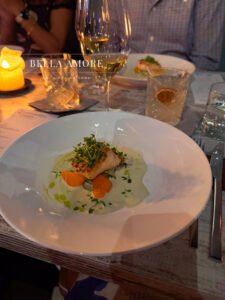 Environmental advertising Professional Food photography - picture of a prepared fish with champagne and cocktails